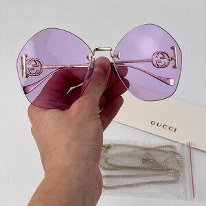 Gucci GG1203S 001 Women’s Rimless Round Sunglasses Gold with Detachable Chain